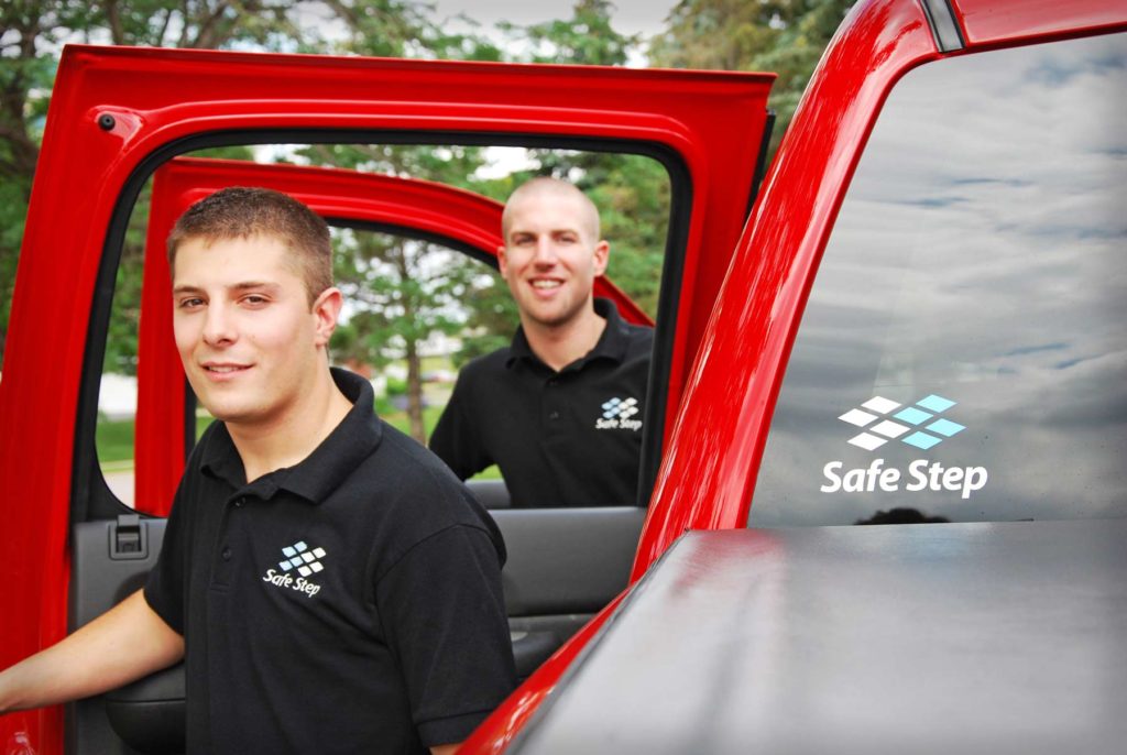 Safe Step technicians getting out of their company truck.