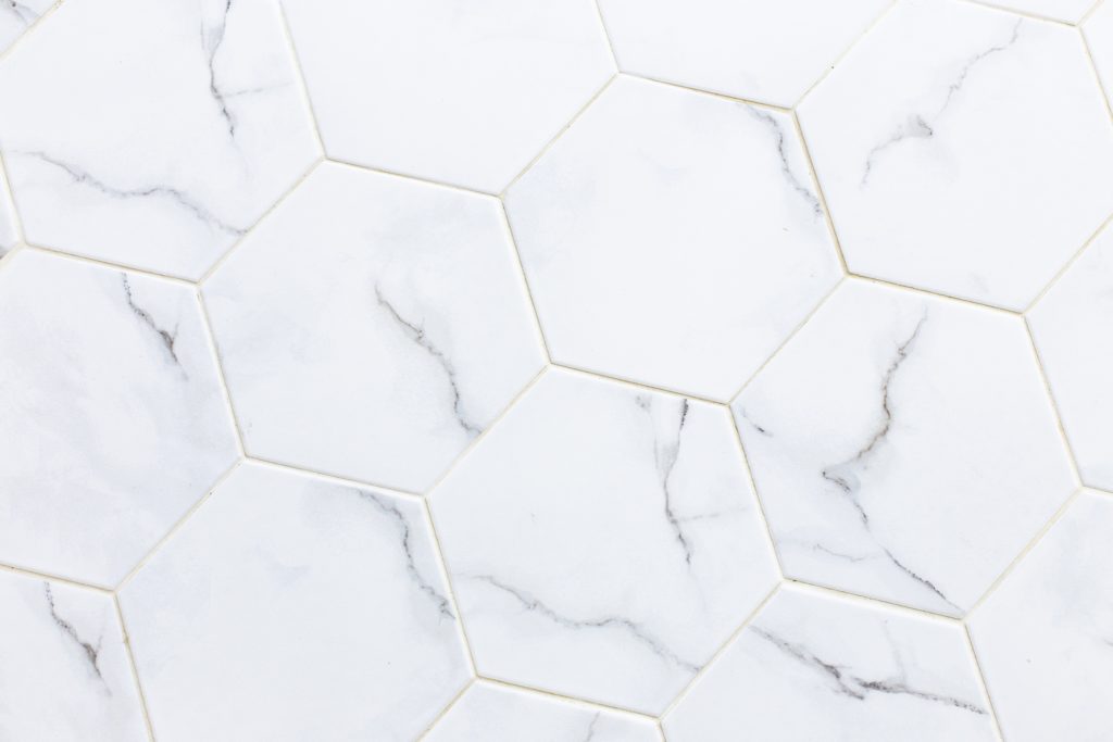 Hexagon marble tiles with healthy grout.