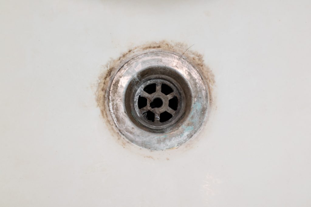 A dirty, dull, hotel bath